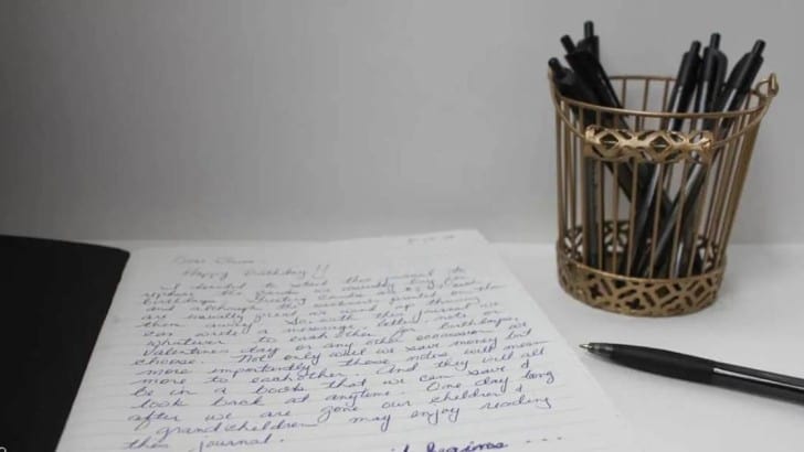 open journal with writing on first page