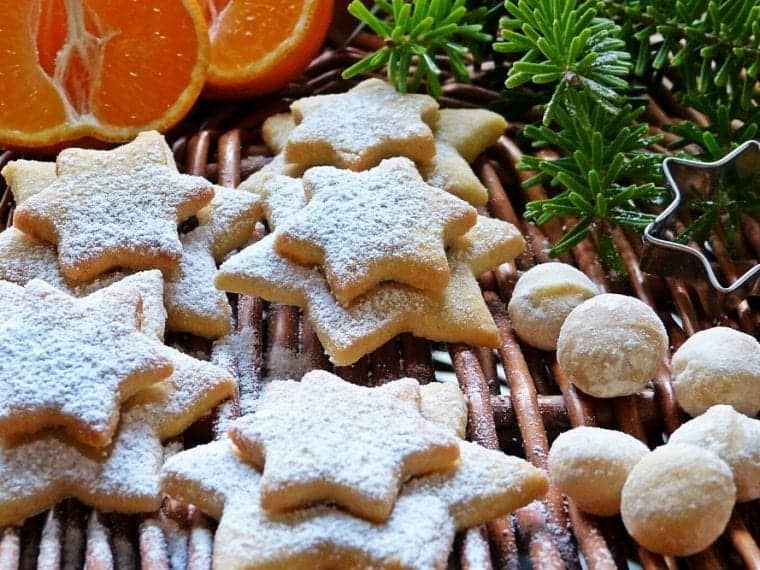 holiday cookies with greenery and cut oranges