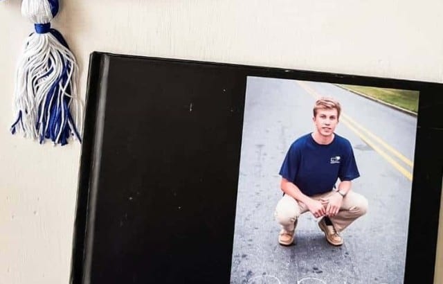 graduation book with cap and tassel
