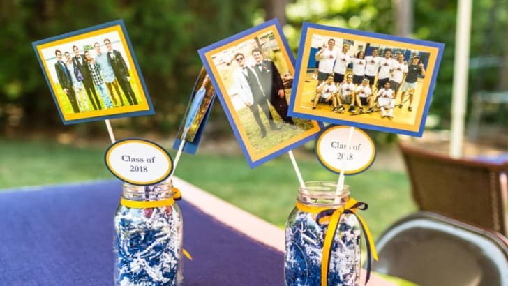 Easy graduation party centerpiece with photos on sticks in mason jars.