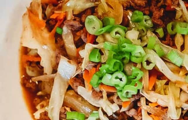 overhead image of a bowl filled with keto Mongolian Beef Egg Roll in a Bowl