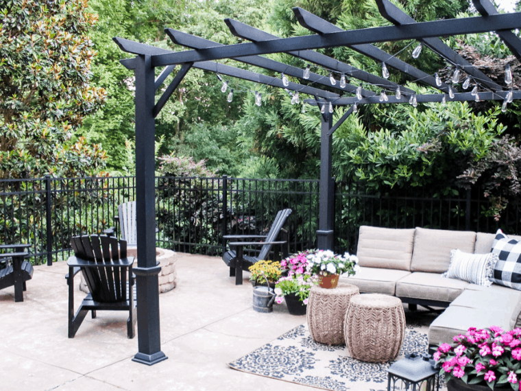 feature photo of patio with seating pergola and firepit