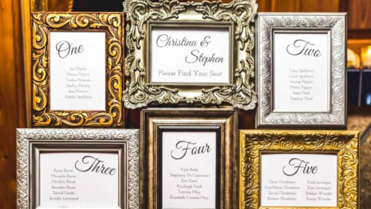 multiple framed wedding seating chart feature photo
