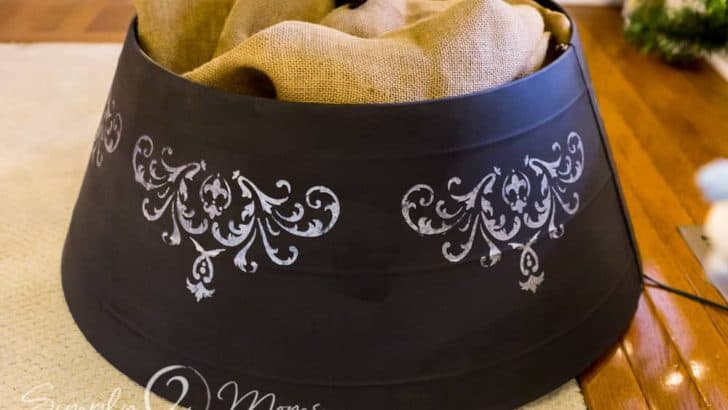 galvanized metal farmhouse Christmas tree collar painted with black chalk paint with French country style stencils filled with burlap and a Christmas tree