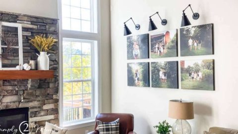 canvas gallery wall in grid style with three lights above in family room