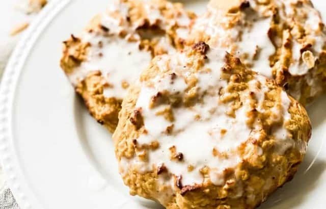 overhead view of three healthy peanut butter banana scones on a plate