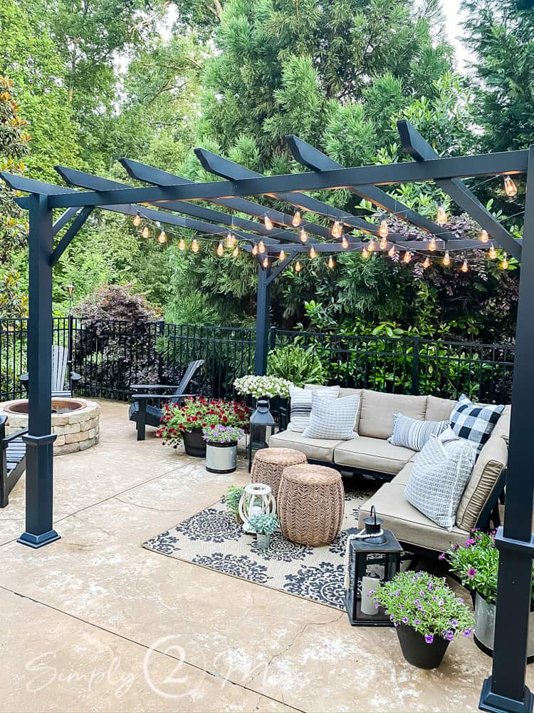patio with outdoor furniture seating area under pergola