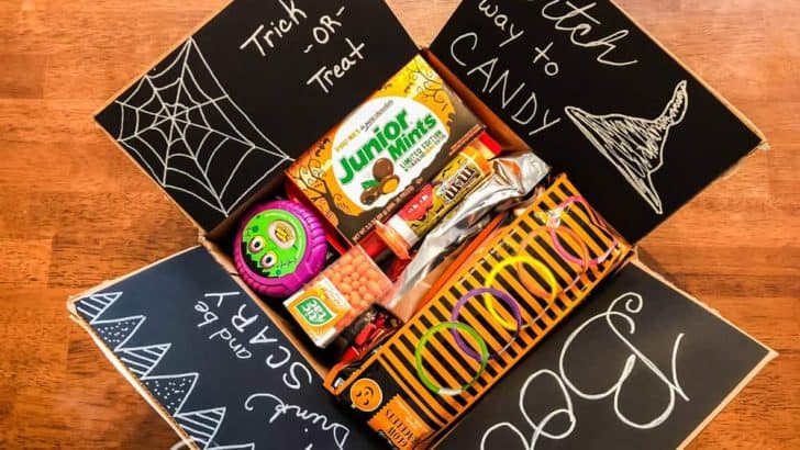 halloween collage care package with decorated box on wood table