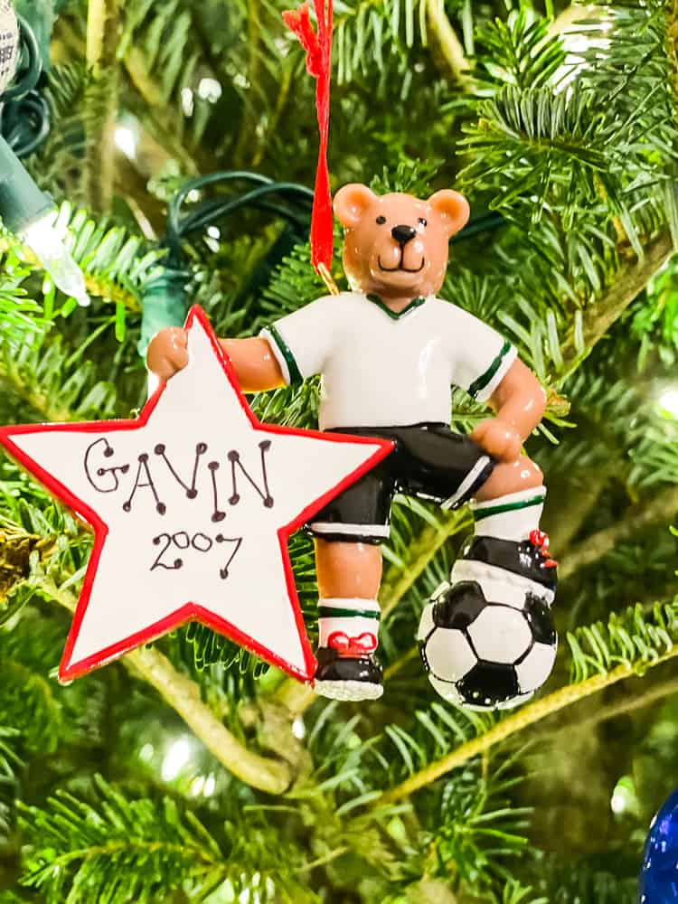 bear soccer player ornament hanging on tree