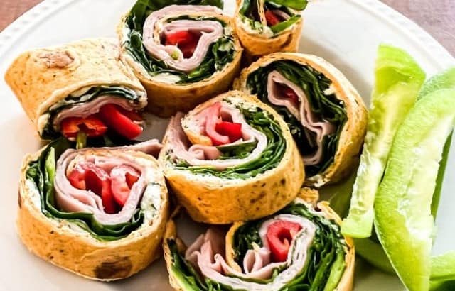 Plate with pinwheel wraps made with red peppers and spinach THM S drive thru sue meal