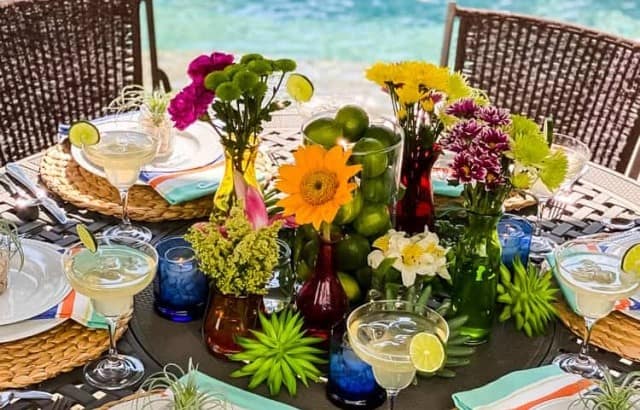 close up of tablescape with floral centerpiece and succulent placesetting toppers