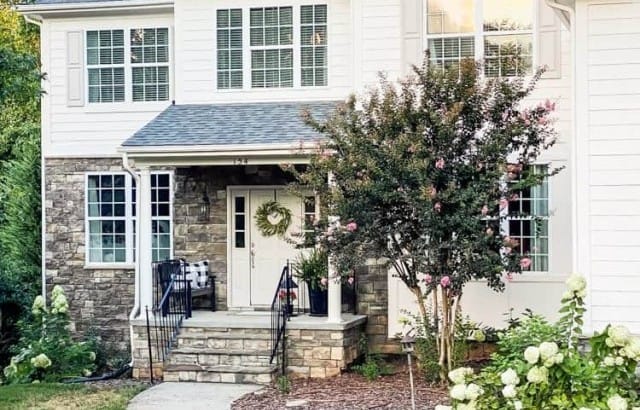 close up of exterior of home after painting shoji white by Sherwin Williams