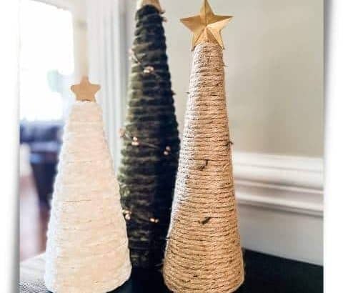 Three DIY Chunky yarn trees with different types and colors of yarn with gold stars on top