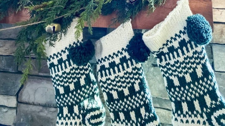 knit green and white stocking hung on wood mantel feature photo