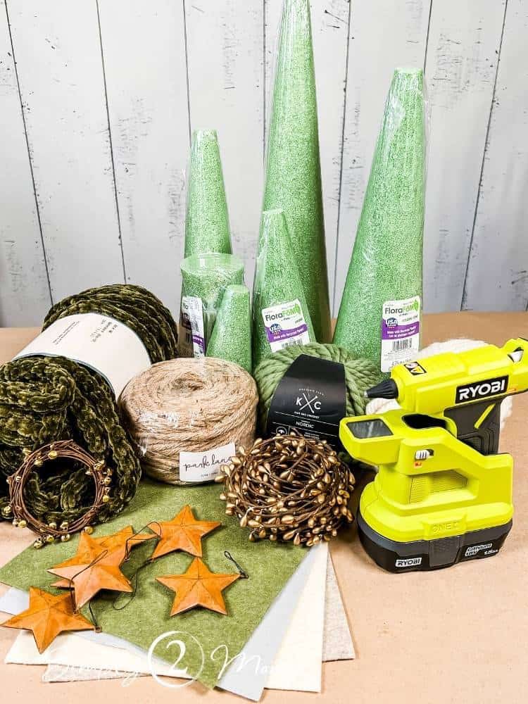 Supplies needed to make chunky yarn trees for holiday decorating.