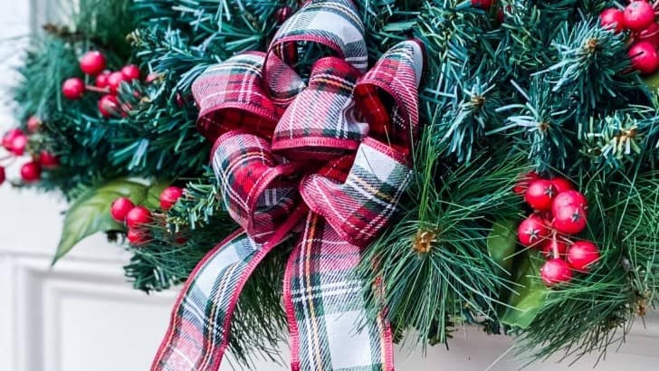 tartan plaid DIY bow on Christmas window greenery