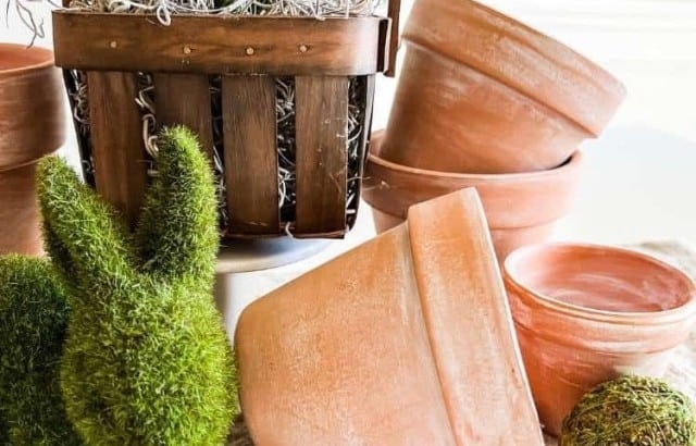 neutral Easter centerpiece with clay pots and baskets