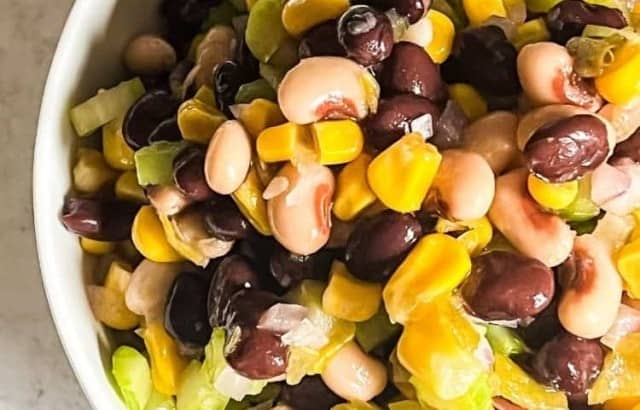 Overhead view of bowl filled with Carolina caviar, a dip made with corn, black beans, black-eyed peas, celery, and onions