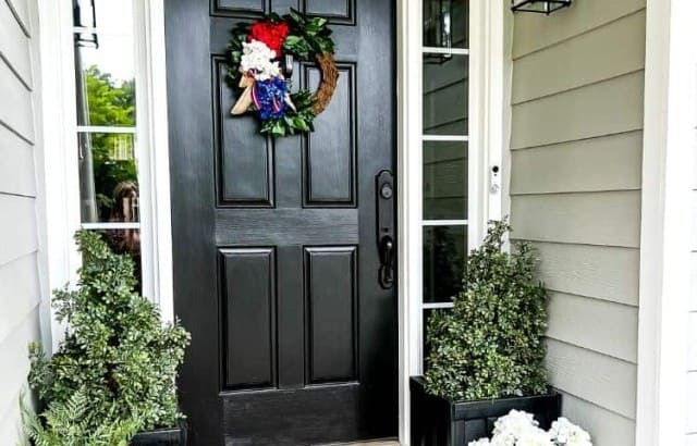 Front door alcove decorated with patriotic decorations for US summer holidays