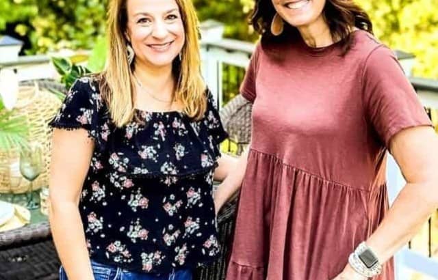 Simply2Moms bloggers standing outside on deck by luau tablescape