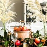 feature photo of fall autumn harvest tablescape styled in dining room