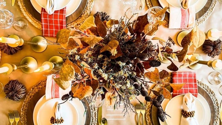 overhead view of tablescape styled with burnt orange accents