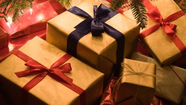 holiday gift guide photo with wrapped presents under tree