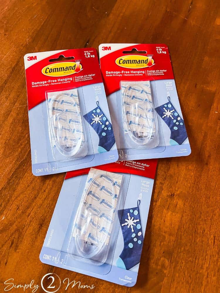 Three packages of large clear command hooks.