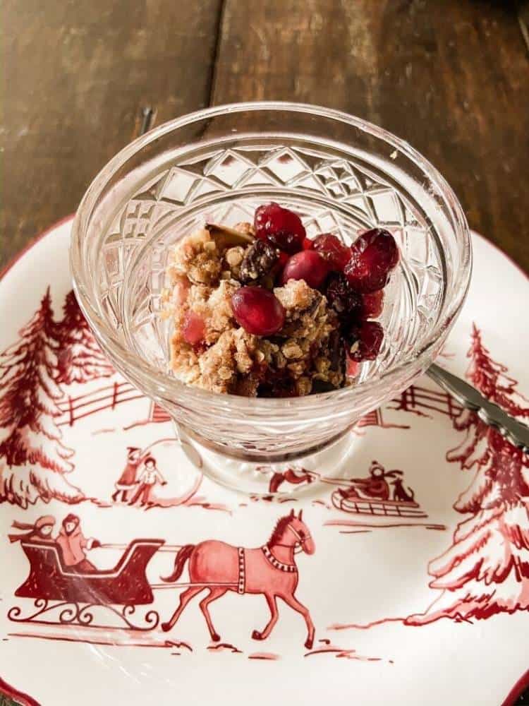 cranberry apple bake in glass dish on red transferware Christmas plate