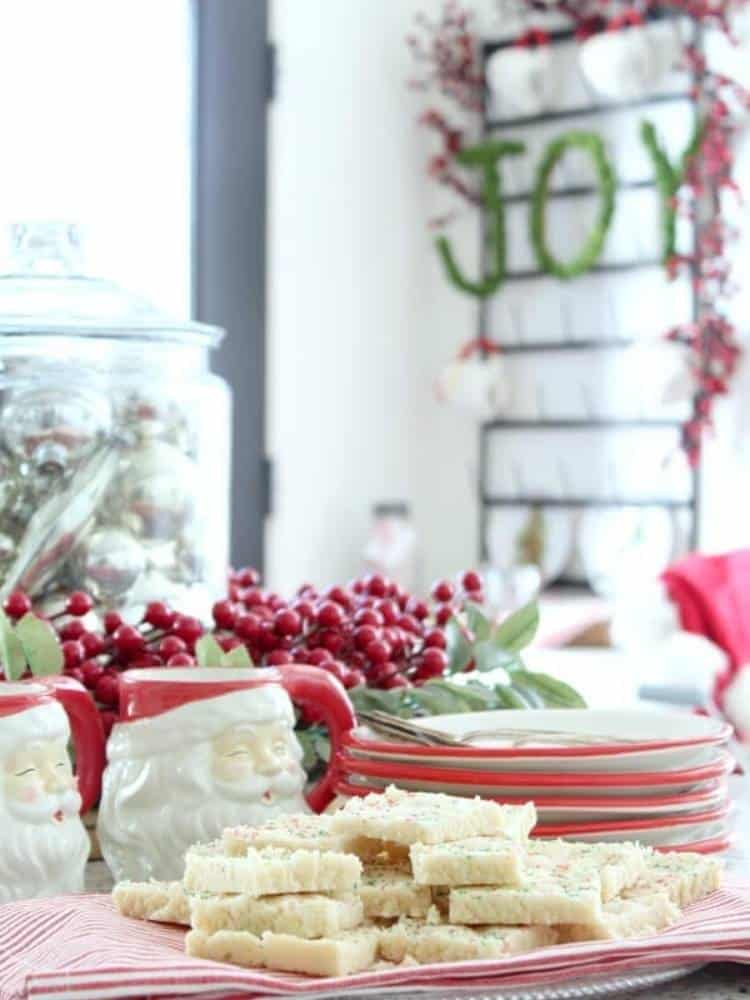 cookies on styled Christmas table with Santa mugs