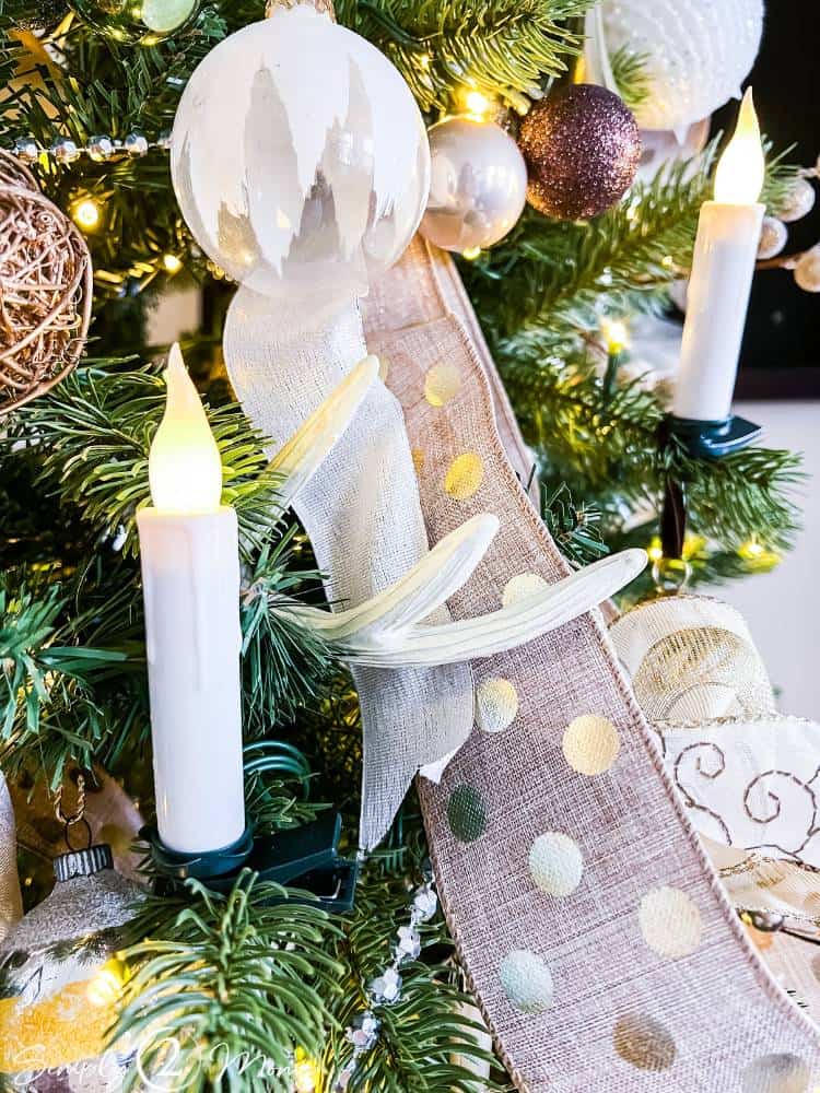 faux clip on candle on Christmas tree decorated