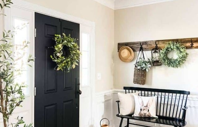 spring foyer decor with greenery rug bench and decor