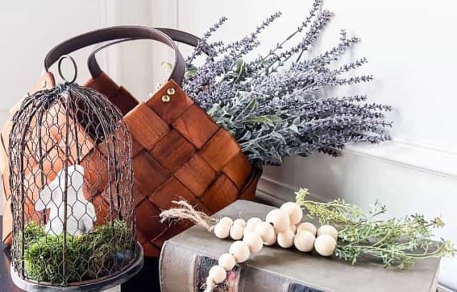 Easter decor with antique books wood bead carrots bunny and faux lavender in basket
