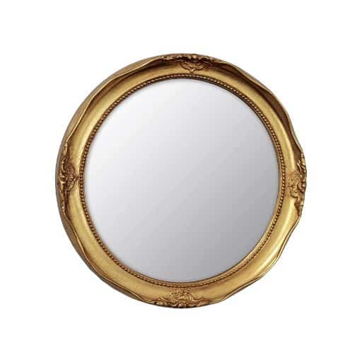 Small round mirror with decorative gold frame.