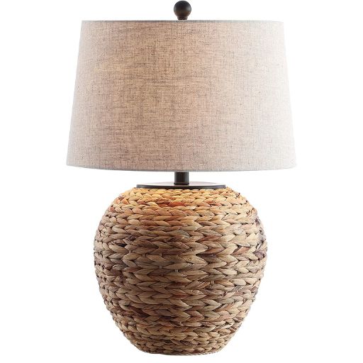 Table lamp with seagrass woven base and linen lamp shade.