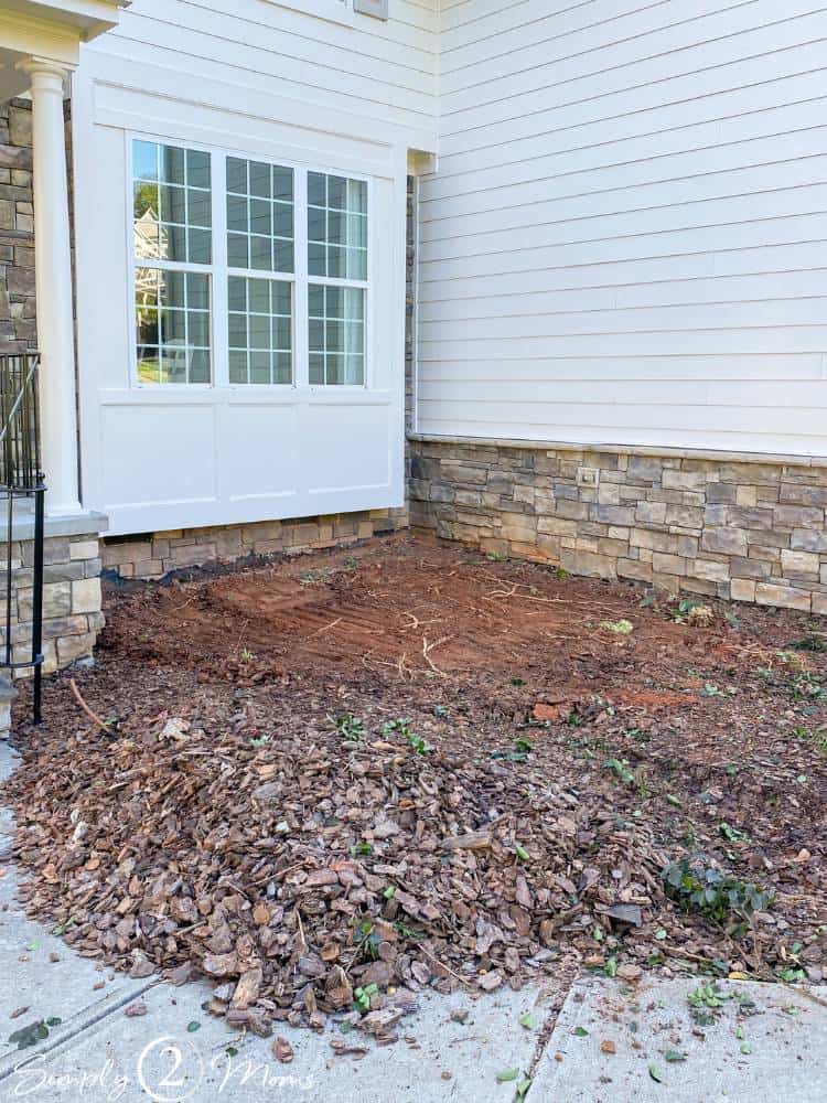 planting bed in front of house after shrubs and tree taken out