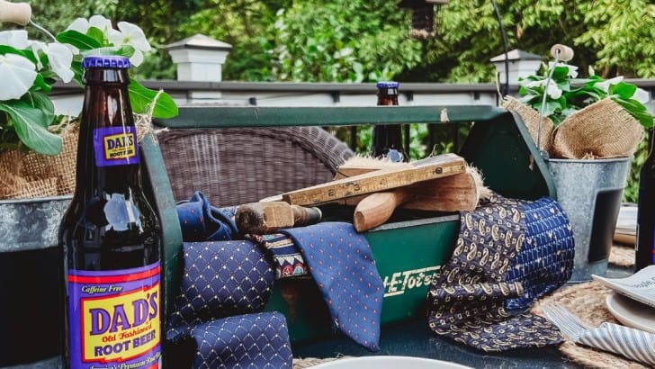 vintage tool box filled with old neckties as centerpiece tablescape feature