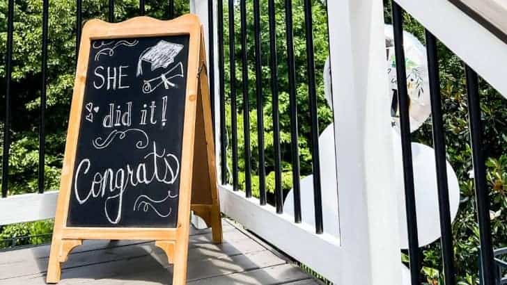 chalkboard easel outside on deck grad party feature