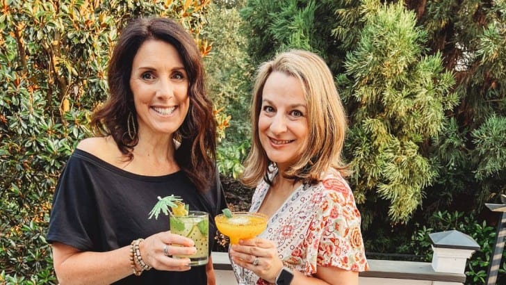 feature photo of bloggers holding cocktails outside