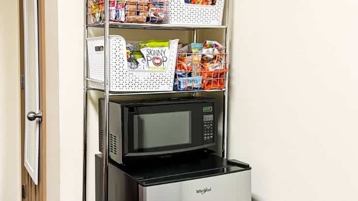 silver shelving over microwave and mini refrigerator feature photo