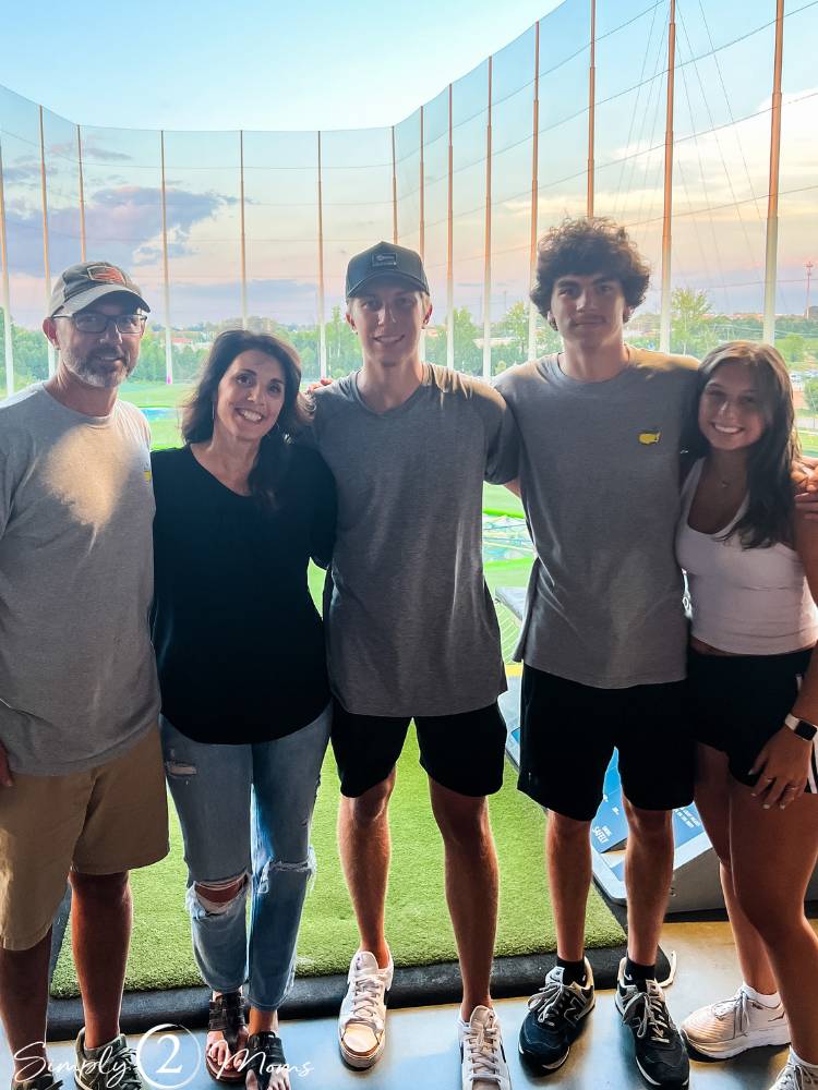 AnnMarie with her family at Topgolf