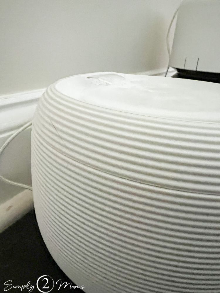 Close up of the Nugget drinking fountain with running water for cats.