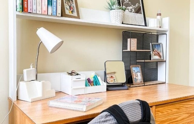 girls dorm room apartment desk with diy shelf on top decorated