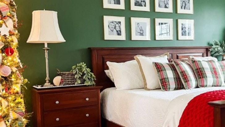 bedroom decorated for Christmas with slim tree and bedding for feature