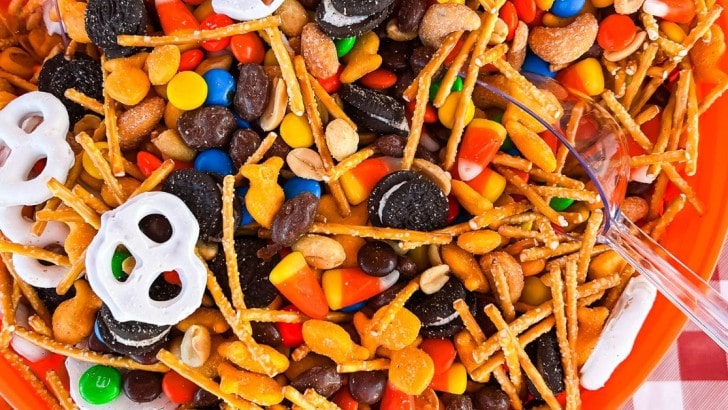Bowl filled with a sweet and salty snack mix for fall or Halloween.