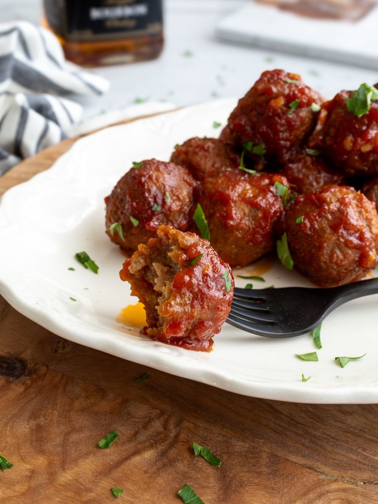 Plate with slow cooker bourbon meatballs from Midwest Life and Style.