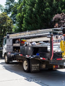 Installation truck bed loaded with new garage door panels.