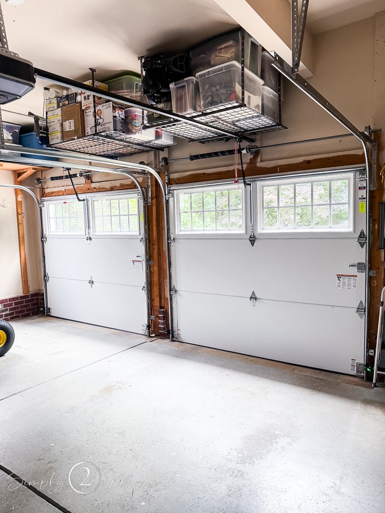 Interior view of a garage showing insulation on the steel doors with windows.