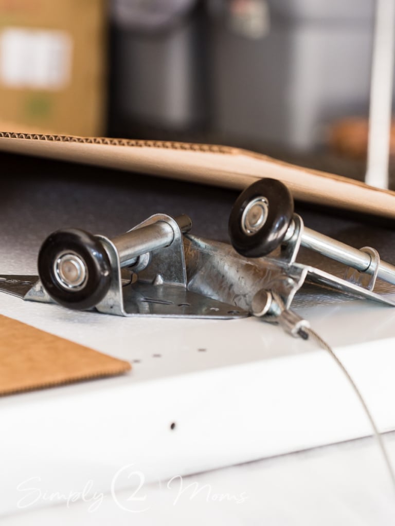 Close up of the nylon rollers with interior ball bearings that quietly operate the replacement garage doors.