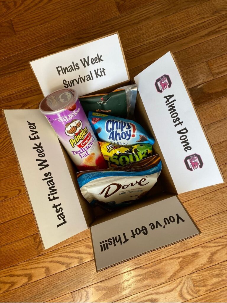 Open finals week college care package filled with snacks and treats, featuring “Finals Week Survival Kit” messages printed inside the box